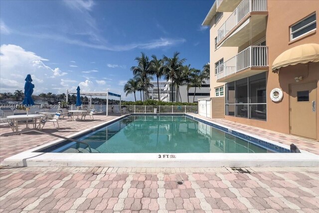 view of swimming pool with a patio area