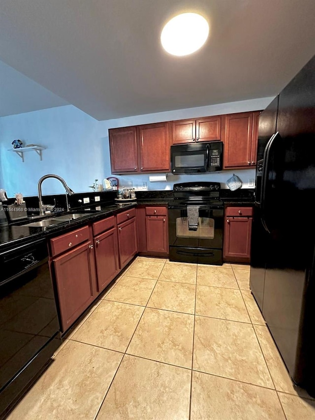 kitchen with black appliances, light tile patterned flooring, and sink