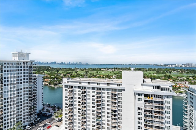 drone / aerial view featuring a water view and a city view