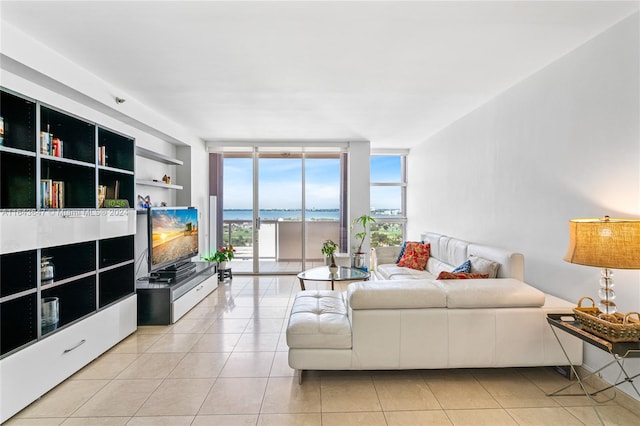 living room featuring floor to ceiling windows and light tile patterned flooring