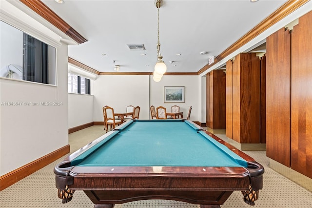 rec room with pool table, crown molding, and light carpet