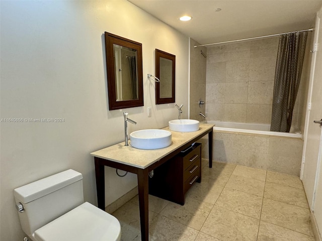 full bathroom featuring tile patterned floors, toilet, vanity, and shower / bathtub combination with curtain