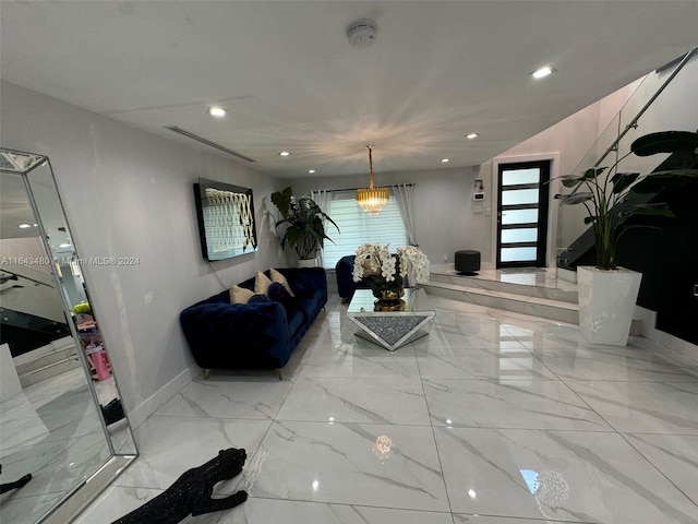 living room with an inviting chandelier