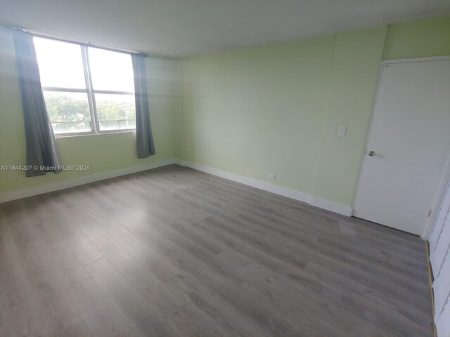 spare room featuring hardwood / wood-style flooring