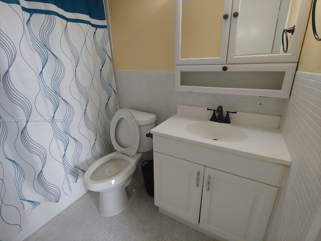 bathroom featuring tile walls, tasteful backsplash, tile patterned flooring, vanity, and toilet