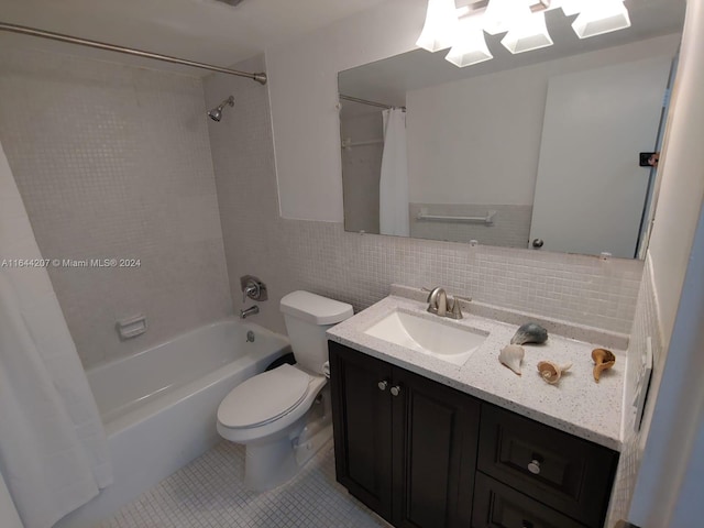 full bathroom with toilet, tile patterned flooring, tasteful backsplash, vanity, and shower / bath combo