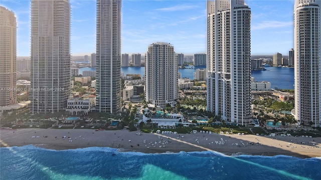 property's view of city with a water view and a view of the beach