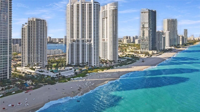 exterior space featuring a water view and a view of the beach