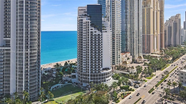 exterior space featuring a water view and a view of the beach