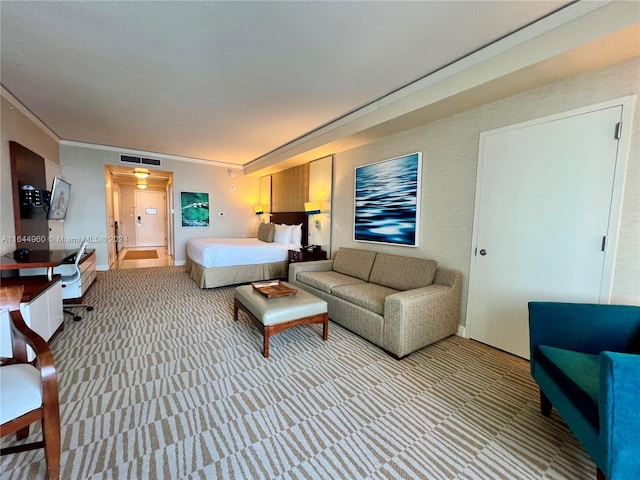 carpeted bedroom featuring crown molding