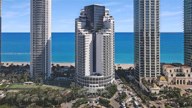 view of city with a water view and a beach view