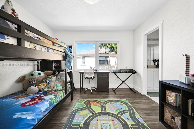 bedroom featuring dark hardwood / wood-style floors and built in desk