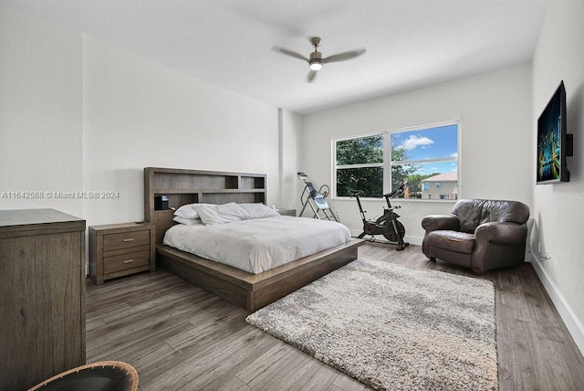 bedroom with hardwood / wood-style flooring and ceiling fan