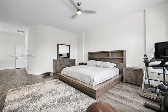 bedroom featuring light hardwood / wood-style flooring and ceiling fan