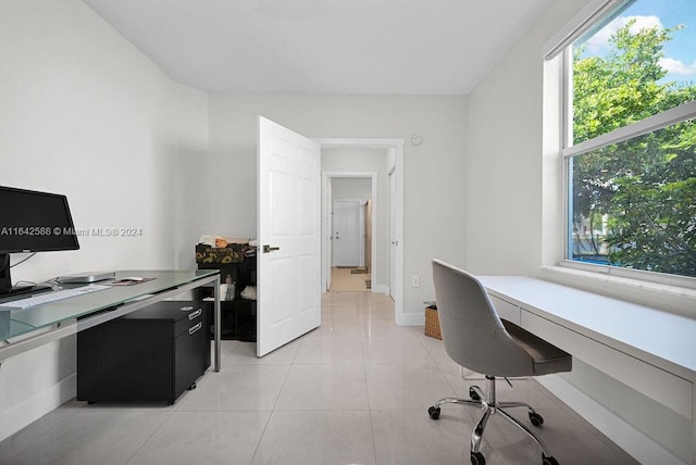 home office featuring light tile patterned floors