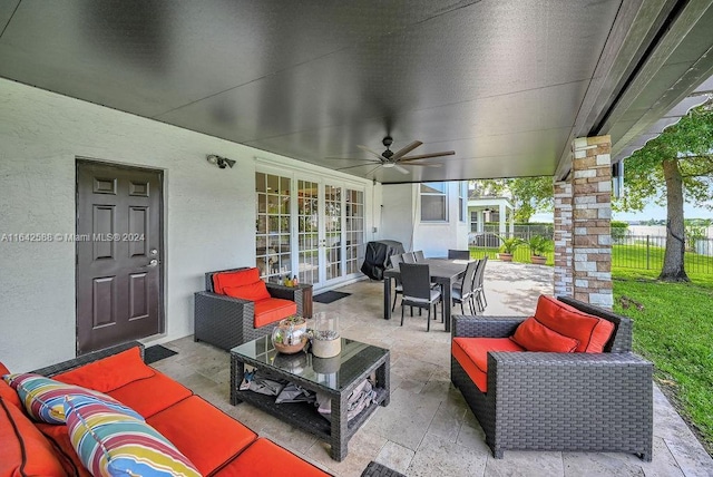 view of patio / terrace featuring ceiling fan and an outdoor living space