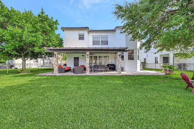 back of property featuring a patio area, a pergola, and a yard