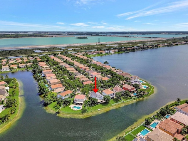 birds eye view of property featuring a water view