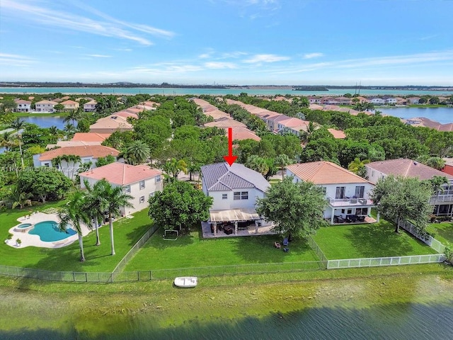 birds eye view of property featuring a water view