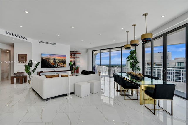 tiled living room with a wall of windows