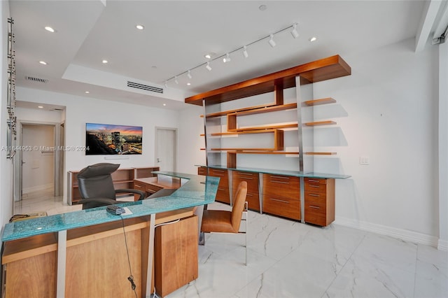 office area with marble finish floor, visible vents, baseboards, and track lighting