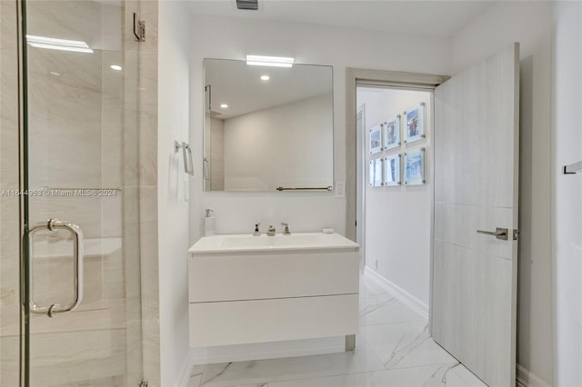 bathroom featuring marble finish floor, visible vents, a stall shower, vanity, and baseboards