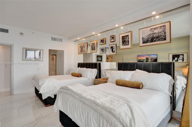 bedroom featuring tile patterned flooring