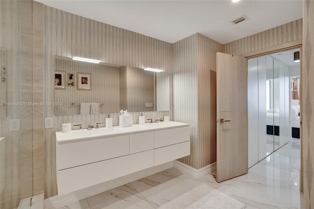 bathroom with tile patterned flooring and dual vanity