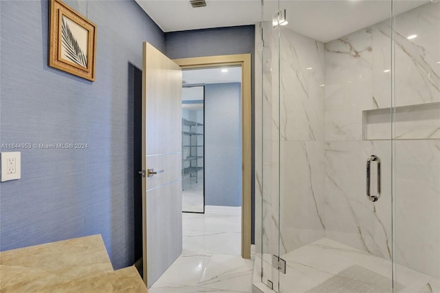 full bathroom with marble finish floor and a marble finish shower