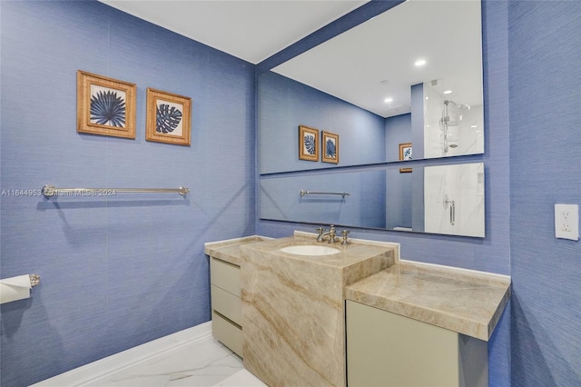 bathroom featuring marble finish floor and vanity