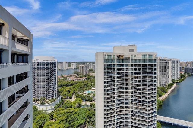 exterior space featuring a view of city and a water view