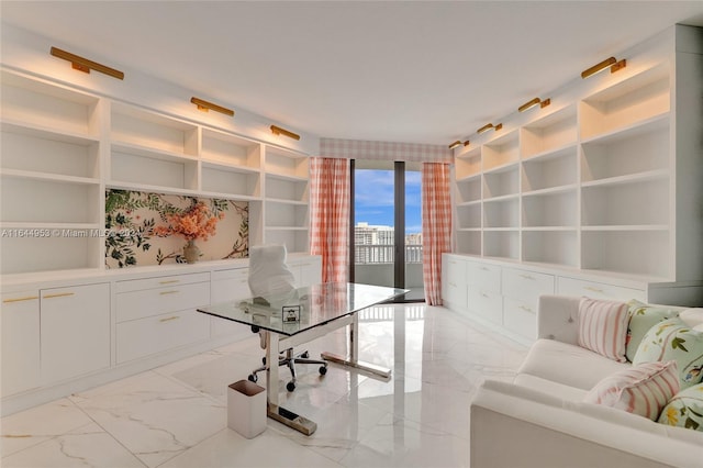 office area with marble finish floor and built in shelves