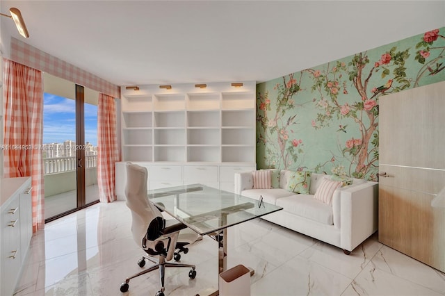 living area with wallpapered walls, marble finish floor, a city view, and french doors