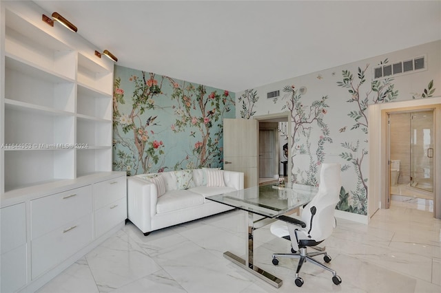 office with baseboards, marble finish floor, visible vents, and wallpapered walls