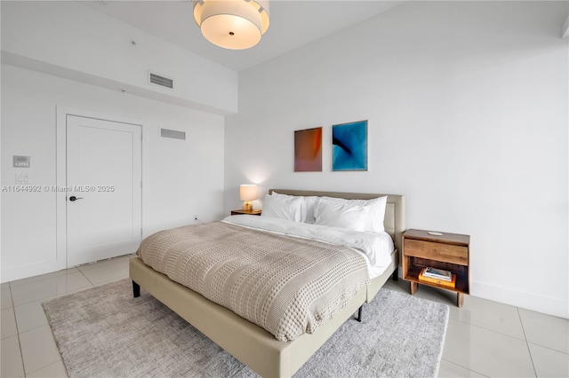 bedroom with light tile patterned floors