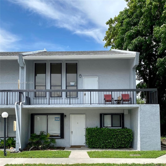 view of front of home with a balcony