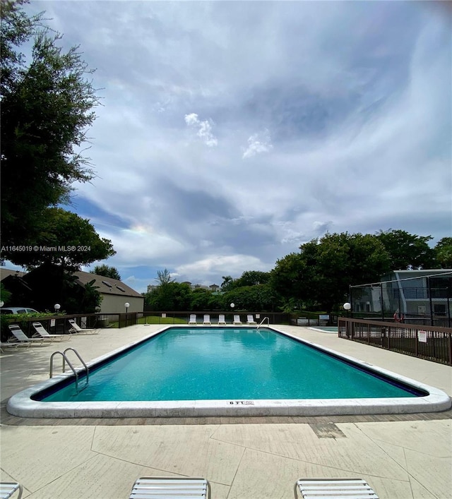 view of pool featuring a patio