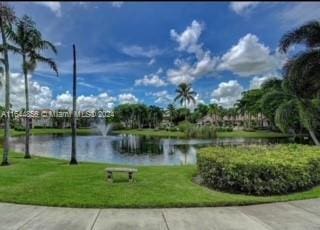 12124 Saint Andrews Pl Unit 112, Miramar, FL 33025 - view of community featuring a water view and a yard