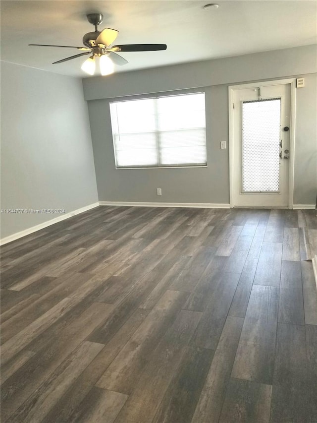 empty room with ceiling fan and hardwood / wood-style flooring