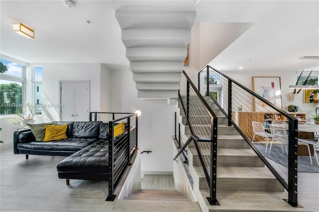 stairs featuring hardwood / wood-style flooring