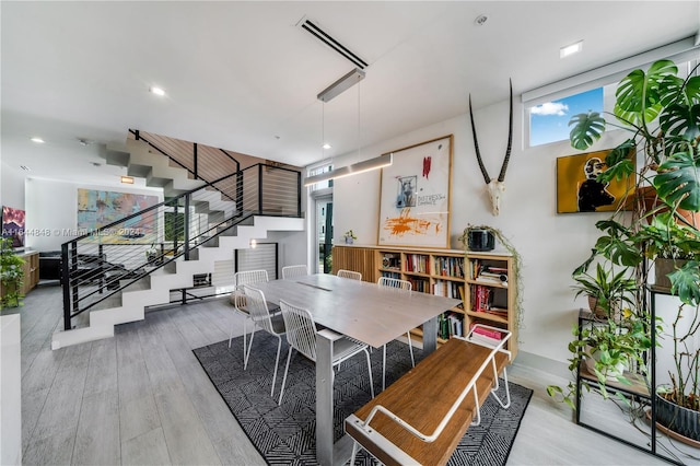 dining space featuring light hardwood / wood-style floors