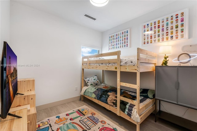 bedroom with light wood-type flooring