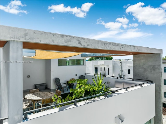 view of patio / terrace with a balcony