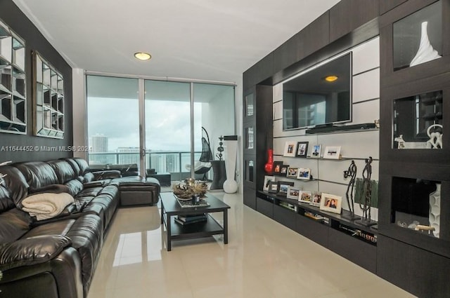 living room featuring floor to ceiling windows and light tile patterned flooring