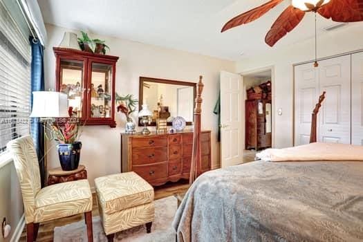 bedroom featuring ceiling fan and hardwood / wood-style flooring