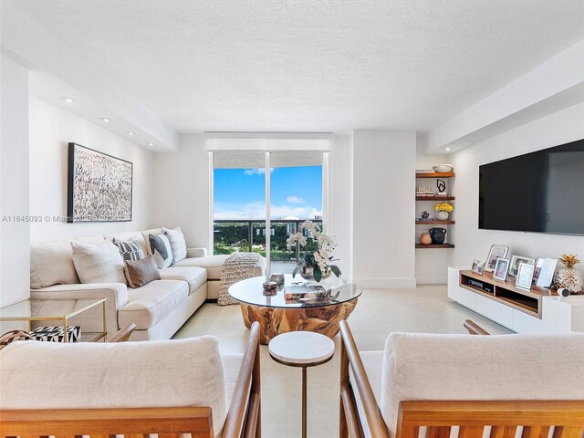 living room with a textured ceiling