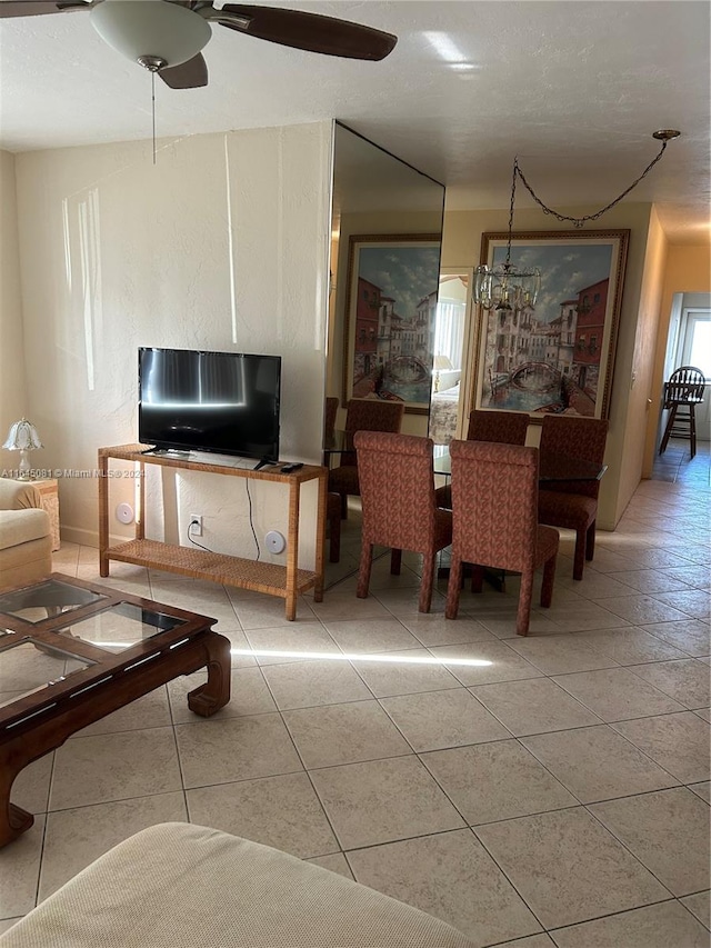 tiled dining space with ceiling fan