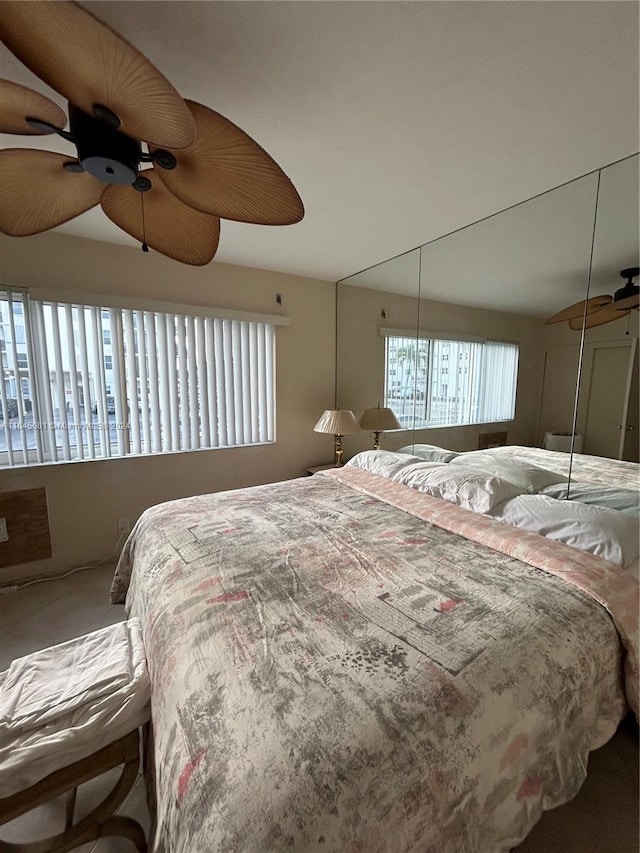 carpeted bedroom featuring ceiling fan