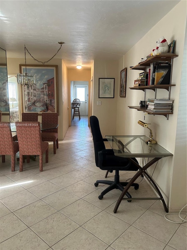 tiled office featuring a notable chandelier