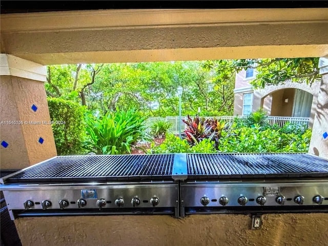 view of patio with a balcony and a grill